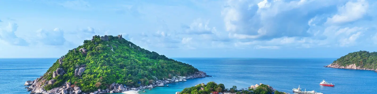a body of water with trees and rocks